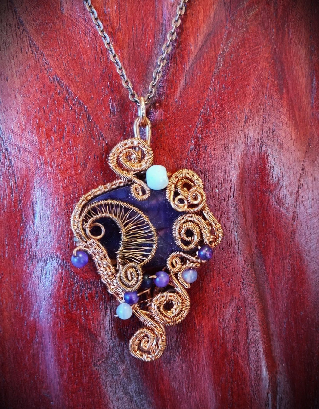 Pendant, hand-wrapped with copper wire by Elizabeth Weiss-Jefferies