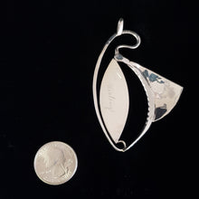 signed back of sterling silver pendant by Tim Terry