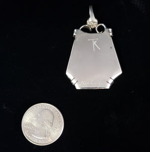 signed back of sterling silver pendant by Tim Terry