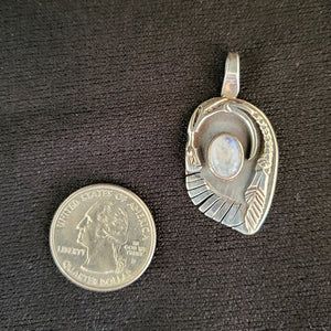 Sterling silver dragon pendant with moonstone by artist Tim Terry