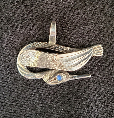 Sterling silver bird pendant with moonstone eye by Tim Terry