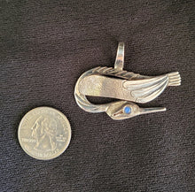 Sterling silver bird pendant with moonstone eye by Tim Terry