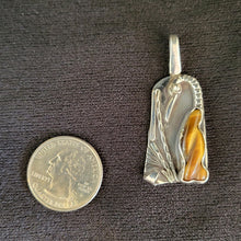 Sterling silver bird pendant with carved tiger's eye stone by Tim Terry