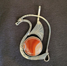 Sterling silver dragon pendant with gold eye and banded agate stone by Tim Terry