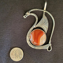 Sterling silver dragon pendant with gold eye and banded agate stone by Tim Terry