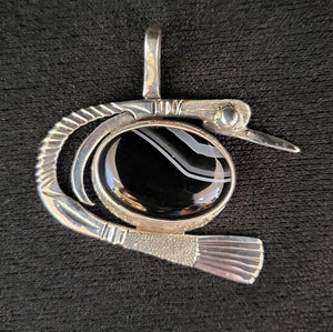 Sterling silver bird pendant with banded agate stone by artist Tim Terry