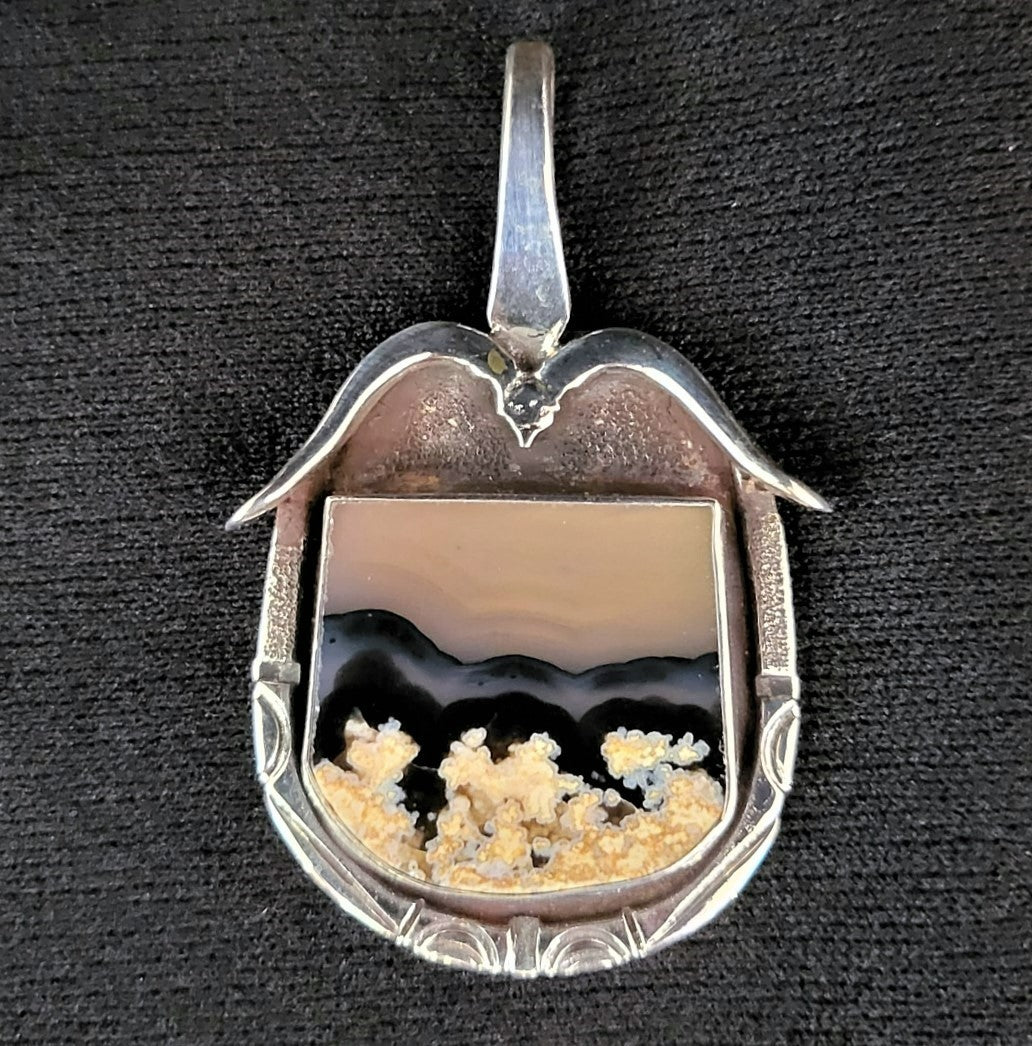Sterling silver bird pendant with plume agate stone by Tim Terry