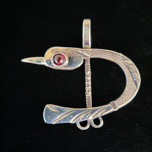 Sterling silver bird pendant with garnet eye by Tim Terry