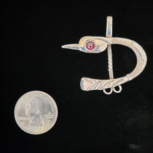 Sterling silver bird pendant with garnet eye by Tim Terry