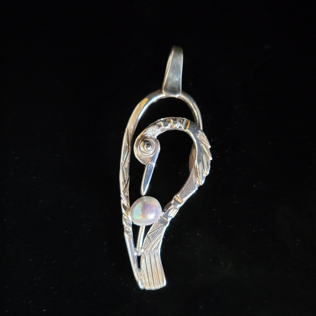 Sterling silver bird pendant with fresh water pearl by Tim Terry