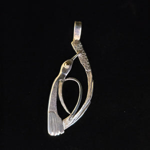 Sterling silver hummingbird pendant with gold eye by Tim Terry