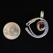 Sterling silver dragon pendant with garnet stone by Tim Terry