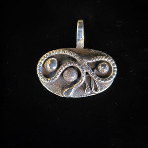 Sterling silver snake pendant by artist Tim Terry