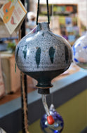 Ceramic hummingbird feeder by Art Baird.