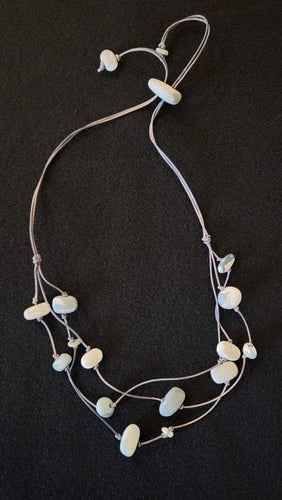Porcelain beads and leather necklace by Dayana Ferrera