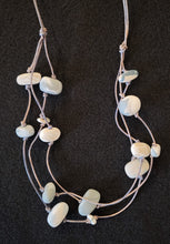 Porcelain beads and leather necklace by Dayana Ferrera